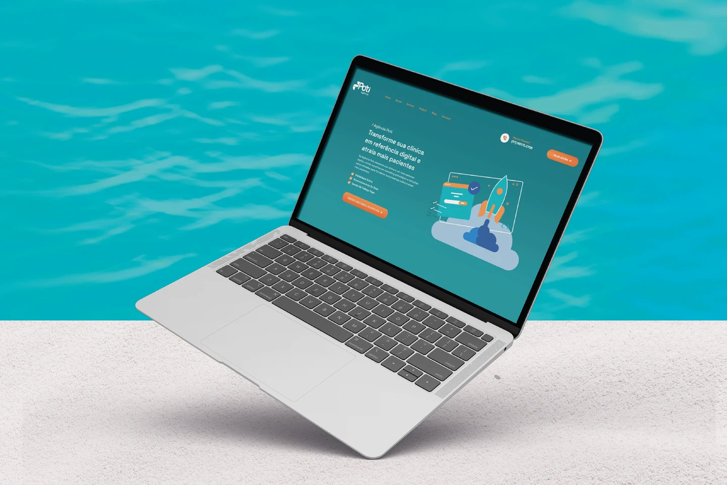 Notebook exibindo um site criado pela iellou, com chamada principal, navegação e interface em tons de azul e laranja.